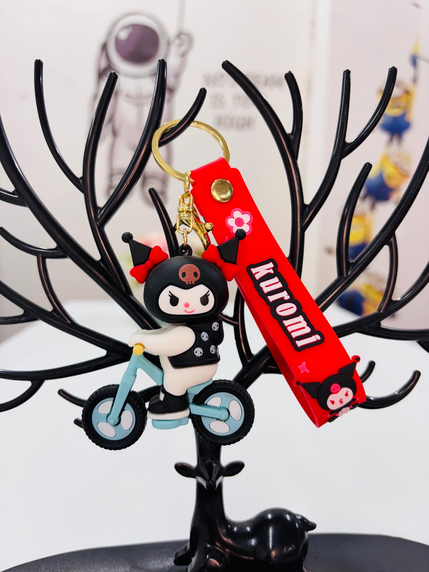 Kuromi On Cycle Black rubber keychain